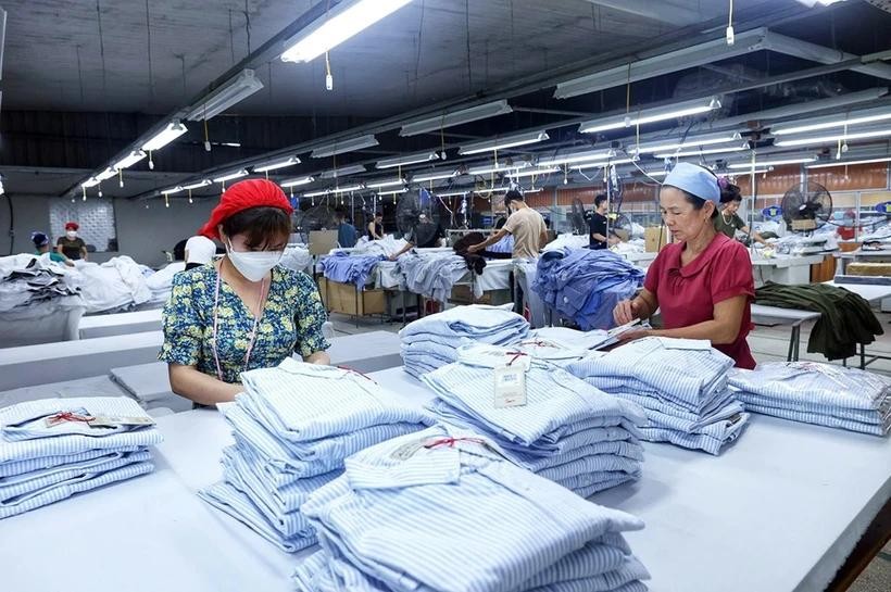 Producing texttile products for export - Illustrative image (Photo: VNA) VNA.webp