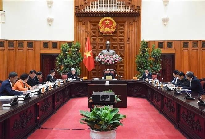 Prime Minister Pham Minh Chinh chairs the meeting in Hanoi on January 11, 2025. (Photo: VNA) vna-potal-thu-tuong-chu-tri-phien-hop-lan-thu-9-ban-chi-dao-ve-sap-xep-tinh-gon-bo-may-cua-chinh-phu-7801817.jpg