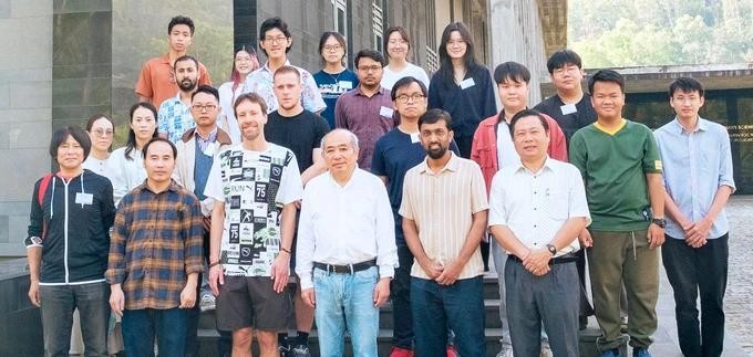 Graduate students, lecturers and leaders of ICISE Center pose for a photo on the sidelines of the event. science.jpg