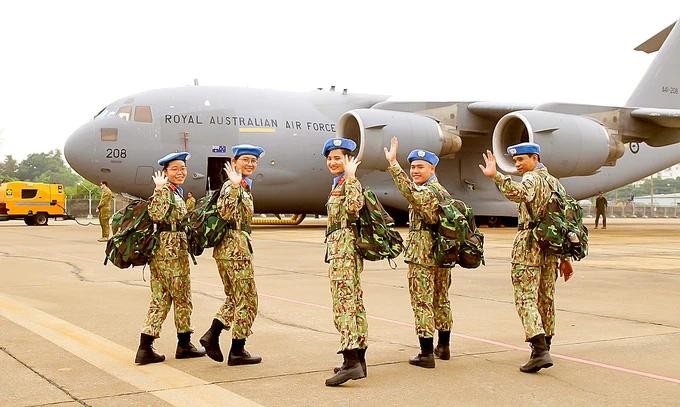Soldiers of Level 2 Field Hospital bid farewell to their homeland, family and friends as they depart for duty in South Sudan beret.jpg