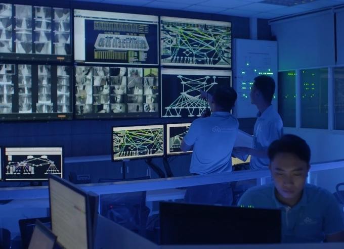 Staff at the monitoring area at CMC Group's data center in District 7 work in their shift CMC.jpg