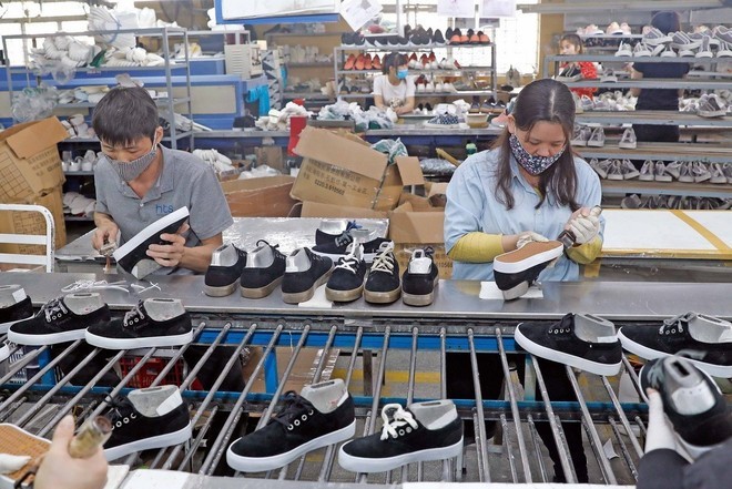Vietnamese textile, footwear exporters eye target markets (Photo: VNA) 0301-da-giay-2.jpg