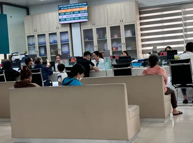 Clients are waiting for their turn to make transactions at a bank img-7367-3164-3907.jpg