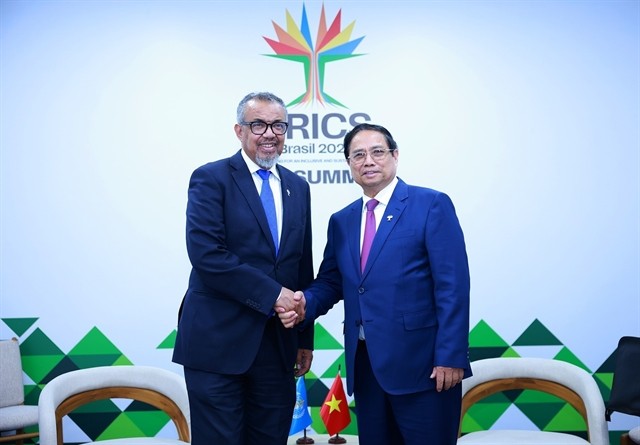 Prime Minister Pham Minh Chinh (R) meets with WHO Director-General Tedros Adhanom Ghebreyesus in Rio de Janeiro on July 6, 2025. (Photo: VNA) 435449_5211315402539858_tedr.jpg