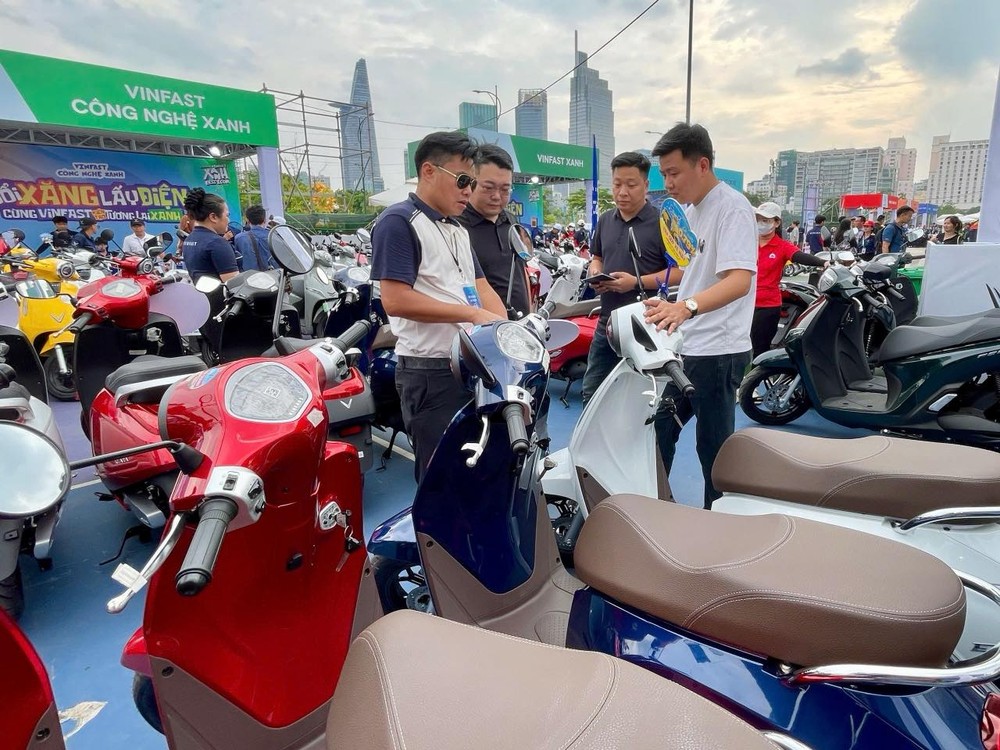Residents participate in the electric vehicle promotion event held at the Bach Dang riverside park in Ho Chi Minh City. electricity.jpg