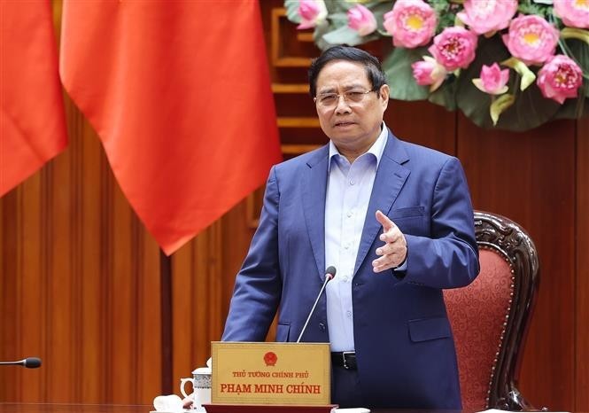Prime Minister Pham Minh Chinh speaks at the meeting of the Government’s standing members on addressing the aftermath of natural disasters. (Photo: VNA) pham-minh-chinh-1.jpg