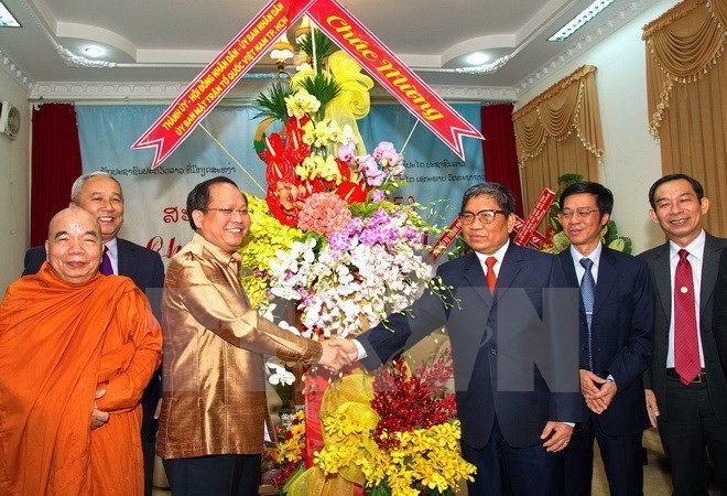 Vice Secretary of the municipal Party Committee Tat Thanh Cang congratulated Lao officials and dignitaries on New Year festival of Laos (Illustrative image. Source: VNA)