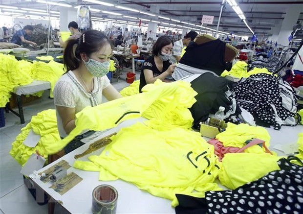 Workers at a garment and textile factory (Source: VNA)