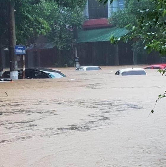 Cars are sunk into floodwater