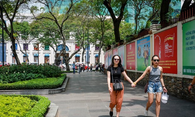 People walk in Le Duan Street, Ho Chi Minh City. (Photo: VnExpress)