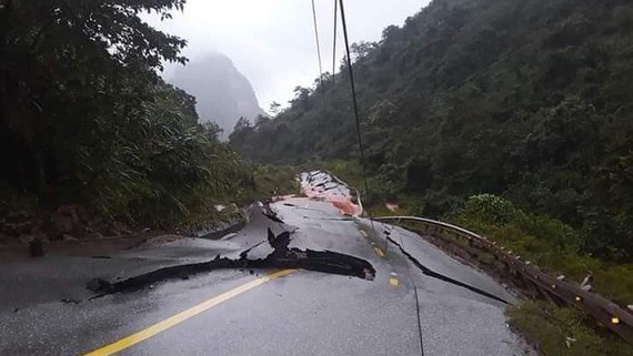 Cracked road surface, ripped fault lines at Cha Lo Border Gate Economic Zone