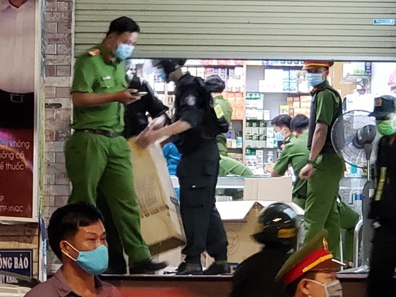 Functional forces check a drugstore in Bien Hoa city