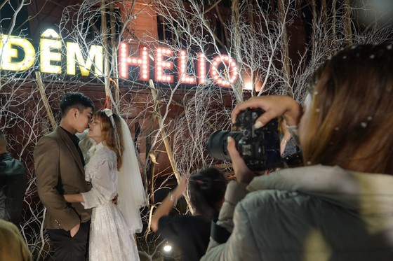 A couple took their wedding photo with Christmas space in the night market. A couple took their wedding photo with Christmas space in the night market.