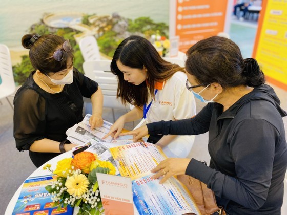 Customers research tours at the travel fair.