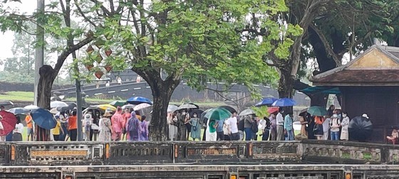Long queue of visitors in front of a ticket selling office of Hue Citadel Long queue of visitors in front of a ticket selling office of Hue Citadel