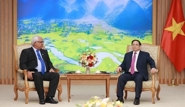 Prime Minister Pham Minh Chinh (R) receives Cuban Minister of Justice Oscar Manuel Silvera Martinez (Photo: VNA) Prime Minister Pham Minh Chinh (R) receives Cuban Minister of Justice Oscar Manuel Silvera Martinez (Photo: VNA)