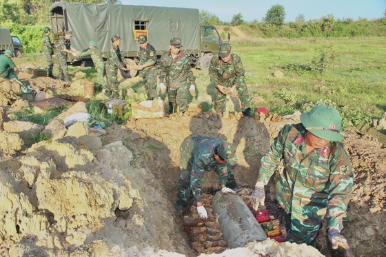 The functional forces are handling bombs in a safe way.