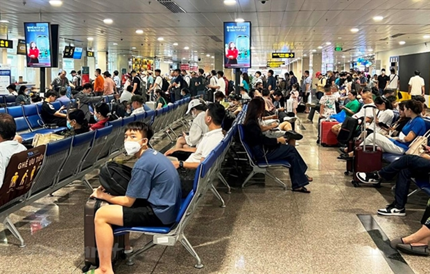 Customers waiting to board plane at Tan Son Nhat International Airport.(Photo: VNA) Customers waiting to board plane at Tan Son Nhat International Airport.(Photo: VNA)