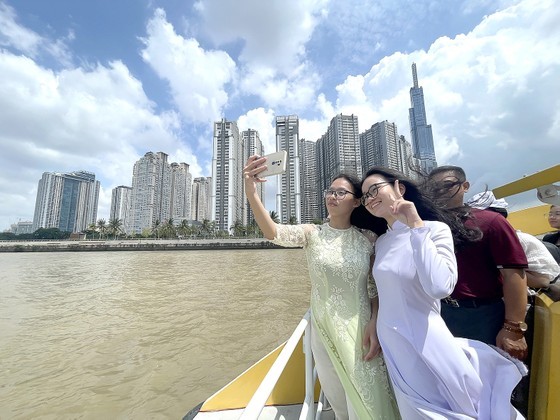 People do sightseeing on the Saigon River People do sightseeing on the Saigon River