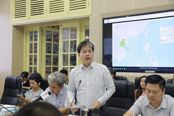 Director of the National Center for Hydro-meteorological Forecasting Mai Van Khiem speaks at a conference this morning.