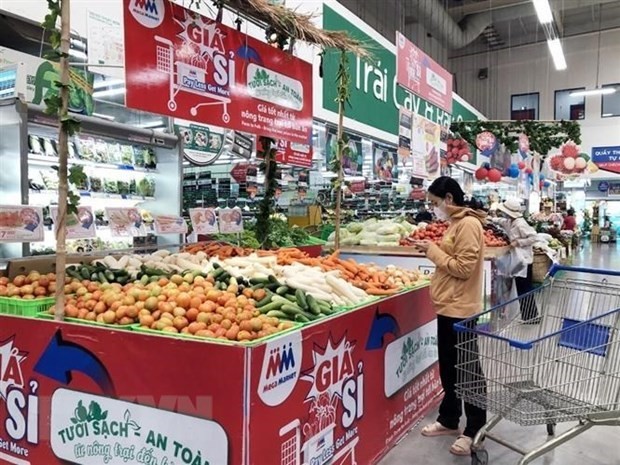People go shopping at a supermarket in Ho Chi Minh City. (Photo: VNA)