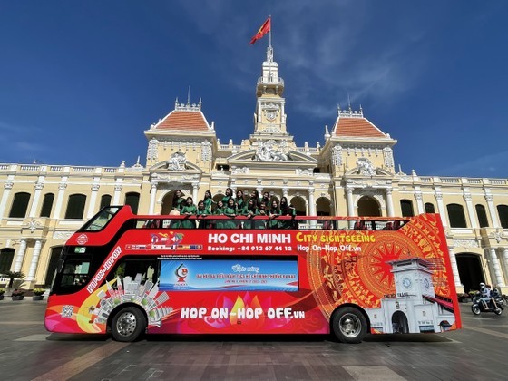 Visitors experience a double-decker bus city tour. Visitors experience a double-decker bus city tour.