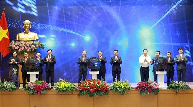 Prime Minister Pham Minh Chinh and other delegates inaugurate the National Legal Portal on Saturday. (Photo: VNA) 427560_11.jpg
