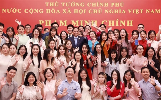 Prime Minister Pham Minh Chinh meets representatives of the Vietnamese community in China on Wednesday.(Photo: VNA) 432947_5201172353208627_pmcvncn.jpg