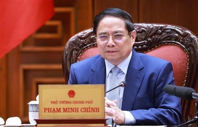 Prime Minister Pham Minh Chinh chairs a meeting on June 28 to continue reviewing and resolving US concerns regarding trade and tariffs. (Photo: VNA) vna-potal-thu-tuong-chu-tri-hop-can-bang-thuong-mai-voi-hoa-ky-8119224.jpg