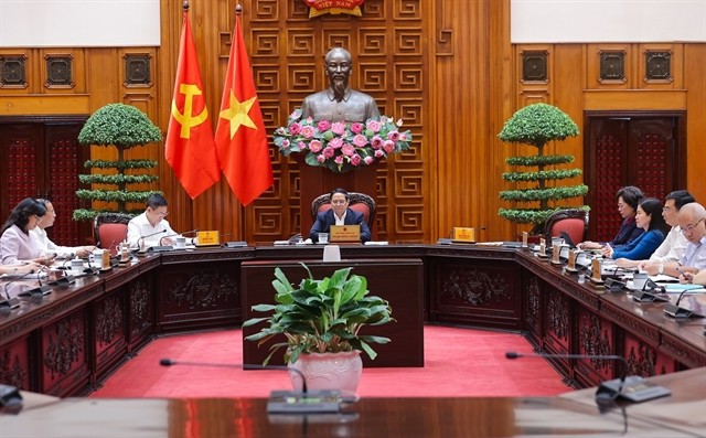 Prime Minister Pham Minh Chinh chairs a meeting with Government members on September 12 in Hanoi. 449730_vna_potal_thu_tuong_chu_tri_hop_ban_giai_phap_dieu_hanh_kinh_te_vi_mo_8272240.jpeg