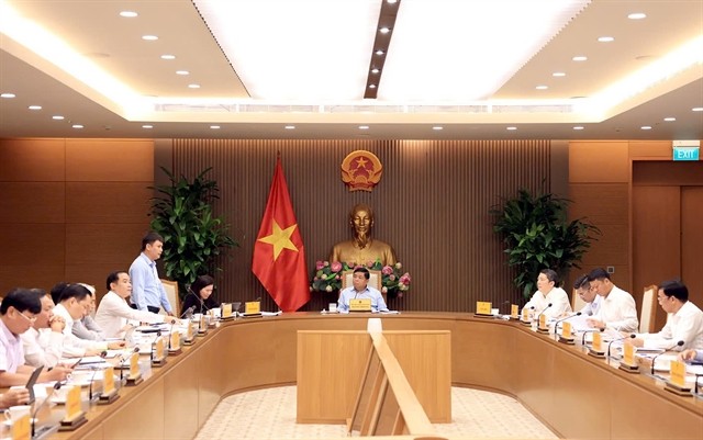 Deputy Prime Minister Nguyen Chi Dung chaired a high-level meeting on a draft resolution aimed at strengthening the role and performance of the State-owned economic sector on Tuesday. (Photo baochinhphu.vn) 453631_5284749027931415_9fdabae9-9372-48f3-ad51-e6c673f0a0c4-17592100643242070557478.jpg