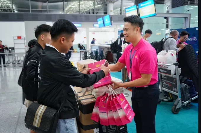 Passengers check in at the counter for the HeForShe flight. 1000013289-7242-9314.jpg