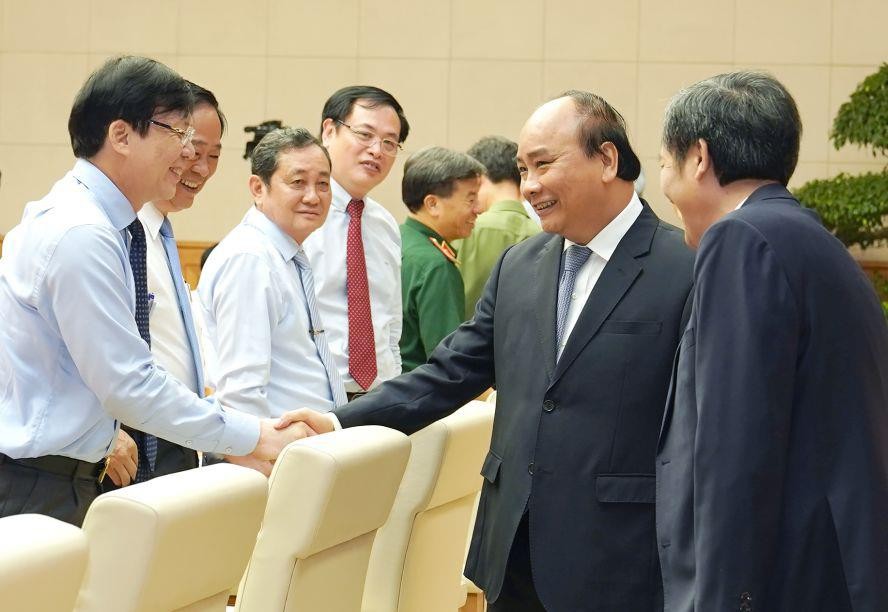 政府總理阮春福與新聞工作者交流。(圖源:光孝)