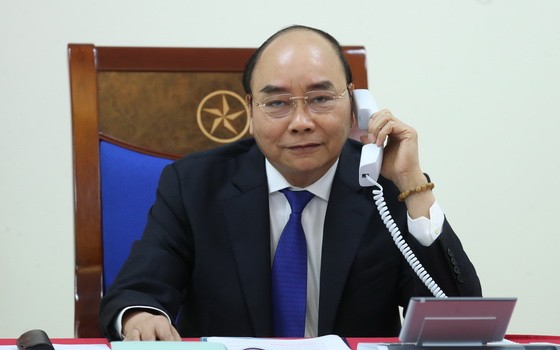 政府總理阮春福與澳大利亞總理莫里森通電話。（圖源：光孝）