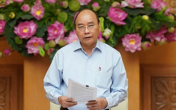 政府總理、價格調度國家指委會主任阮春福主持會議並發表講話。(圖源:光孝)