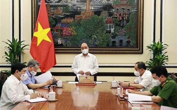 國家主席阮春福(中)主持會議。(圖源:越通社)
