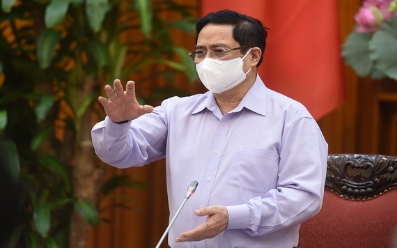 政府總理范明政主持會議並發表講話。(圖源:VGP)