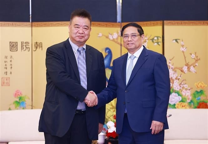 政府总理范明政会见昆明国际花卉拍卖交易中心有限公司领导。(图:越通社)