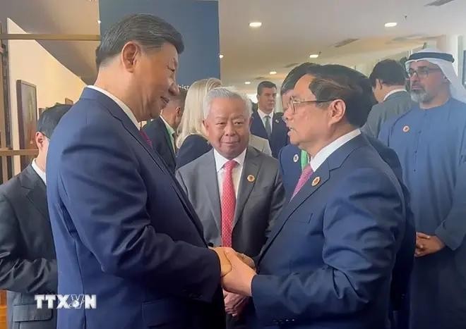 范明政总理会见中共中央总书记、国家主席习近平。(图:越通社) 范明政总理会见中共中央总书记、国家主席习近平。(图:越通社)