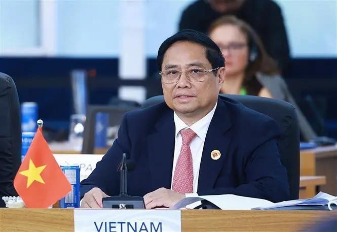 政府总理范明政出席可持续发展和能源转型讨论会并发表讲话。(图:越通社)
