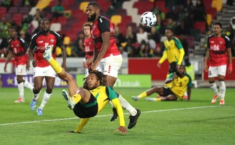 Rumarn Burrell ghi bàn thứ hai cho Jamaica bằng cú đá xe đạp chổng ngược trong chiến thắng 3-2 tại Unity Cup trước Trinidad và Tobago tháng Năm.