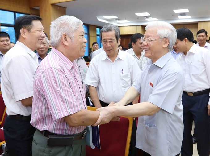 Party General Secretary Nguyen Phu Trong (right) meeting yesterday with voters in Hanoi, affirmed the Party and State’s resolve to conduct a “no-holds-barred” crackdown on corruption and negative phenomena. (Photo: VNA/VNS)