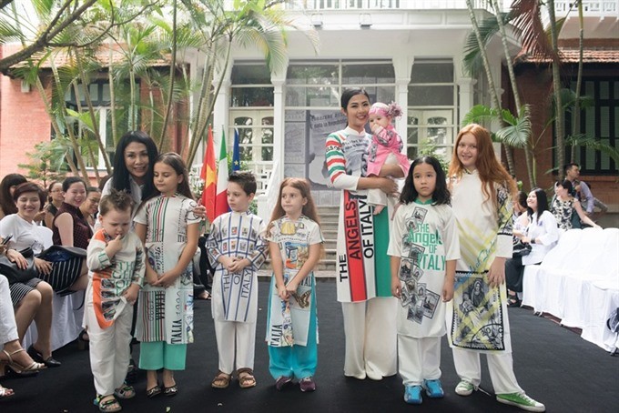 Special models present designs honouring the cultural exchange between Vietnam and Italy in an event last year. (Photo: VNS)