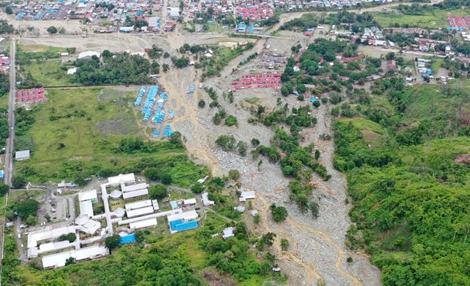 This aerial photo shows the area affected by flash floods in Sentani, Papua province, Indonesia, on March 18, 2019. Flash floods and mudslides triggered by downpours tore through mountainside villages in Indonesia’s easternmost province, killing dozens of