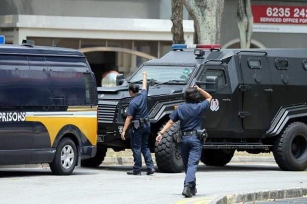 A police vehicle transporting Ahmed Hussein Abdul Kadir Sheik Uduman to Singapore's State Courts (Photo: straitstimes)