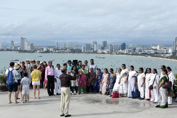 Tourists from India pose for pictures at Phra Tamnak Hill in Pattaya, Thailand. (Photo: Bangkok Post)