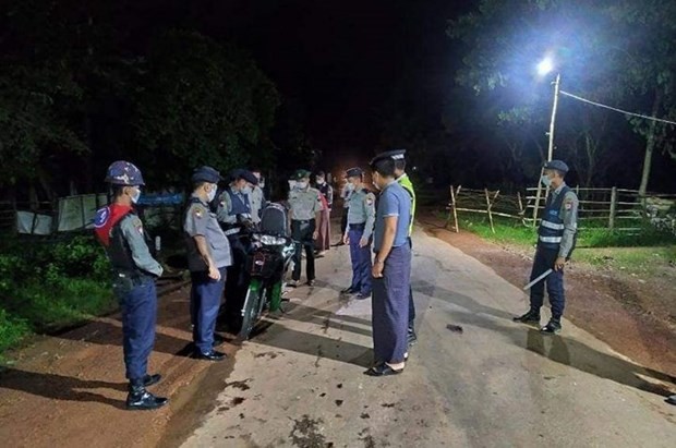 Police check a motorcycle in Yangon, Myanmar on 3 September after a curfew was imposed to prevent the spread of COVID-19. (Photo: gnlm.com.mm)