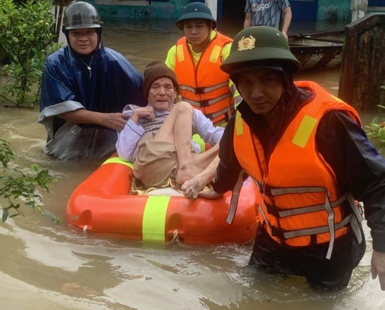 Rescue workers move the old man to safety