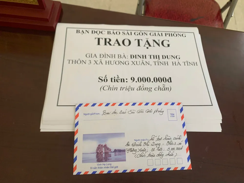 Số tiền 9 triệu đồng của bạn đọc Báo SGGP hỗ trợ bà Đinh Thị Dung z7000699814665_61471893d5ac6fa99d5fb3189b33fb1a.jpg
