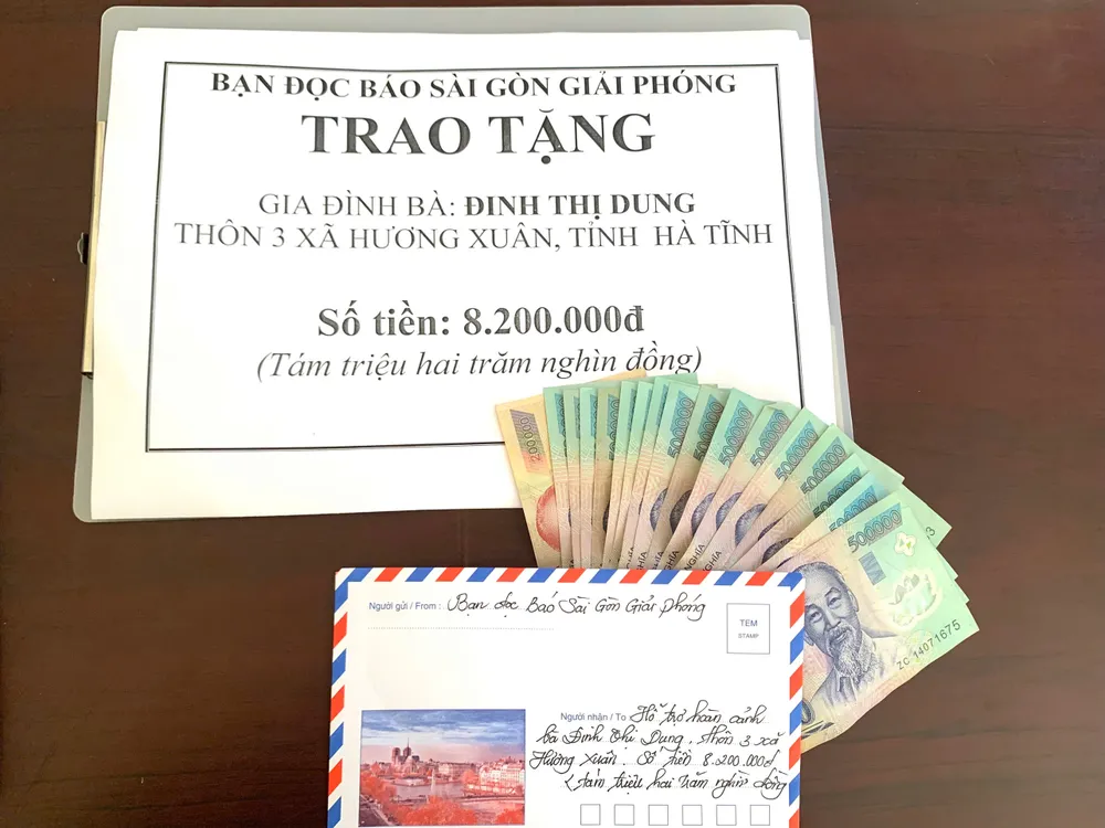 Số tiền 8,2 triệu đồng của bạn đọc Báo SGGP hỗ trợ bà Đinh Thị Dung z7115444206423_24e60205ad14a2a95b6ad87119c106a9.jpg